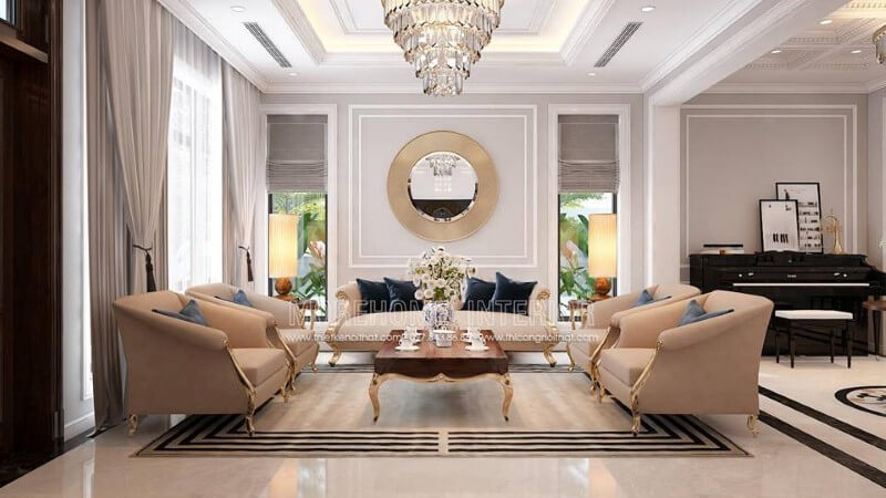 Bộ bàn ghế sofa tân cổ điển mạ vàng gam màu trắng sữa nhẹ nhàng nhưng lại tạo điểm nhấn đẹp, sang trọng cho phòng khách. thiết kế biệt thự tân cổ điển