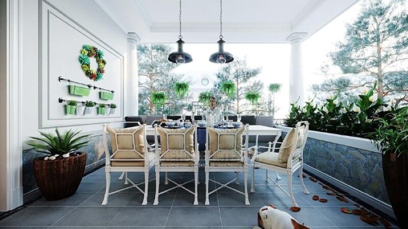 Thiết kế không gian ăn uống ngoài trời đẹp mắt với hệ thống cây xanh tươi mát cùng bộ bàn ghế ăn êm ái. Thiết kế biệt thự